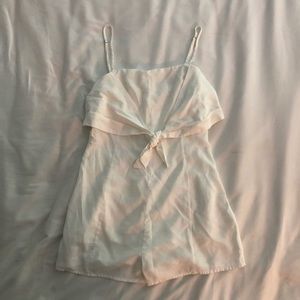 White romper with bow tied in front